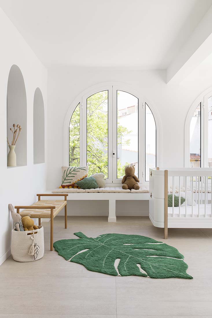 A large green leaf-shaped rug