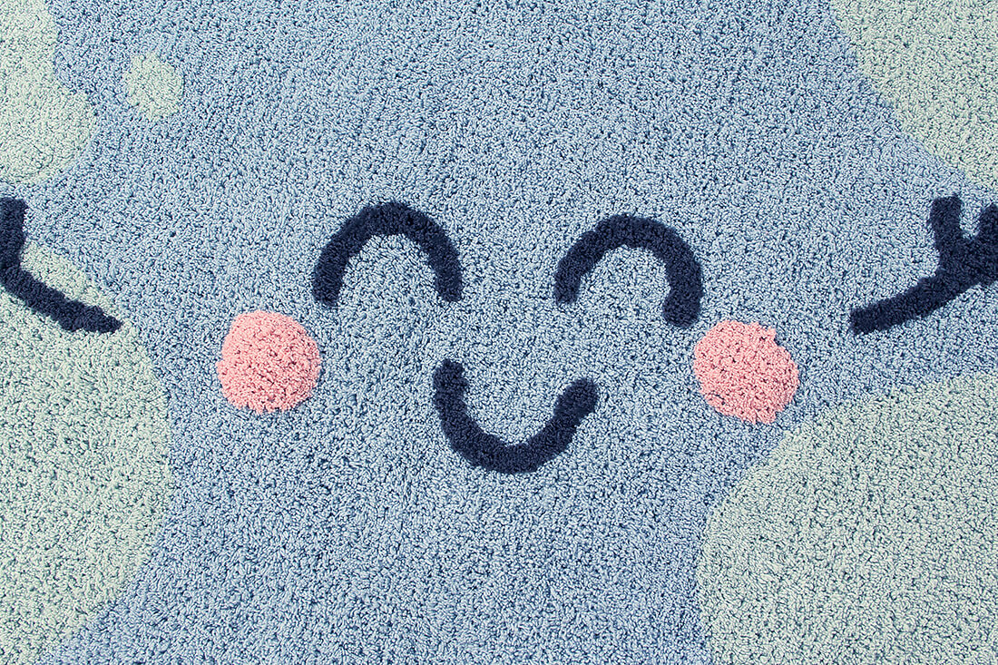 cotton tufted round rug shaped as a smiling globe