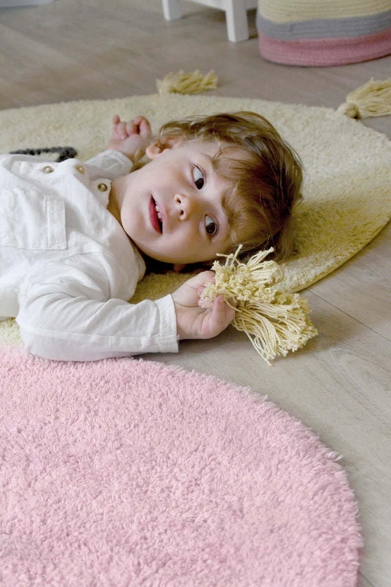 cotton tufted round rug shaped as a smiling sun
