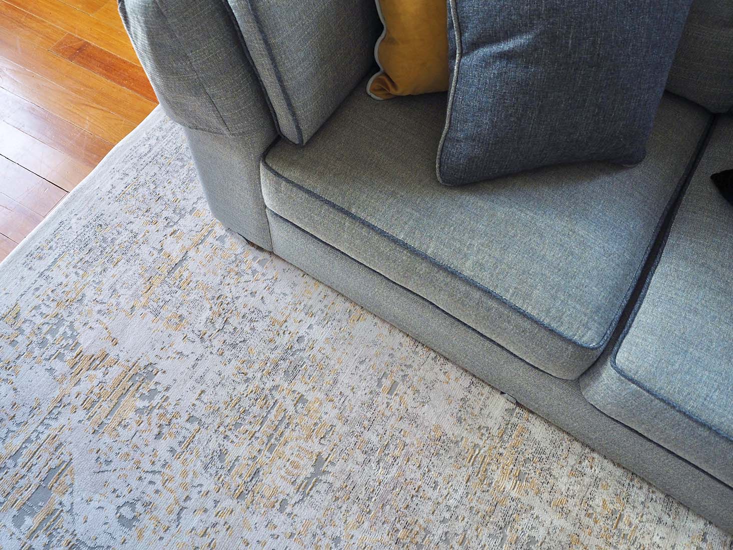 Persian style area rug in yellow and grey