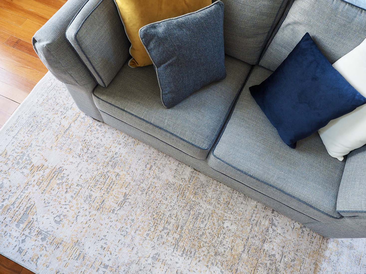 Persian style area rug in yellow and grey