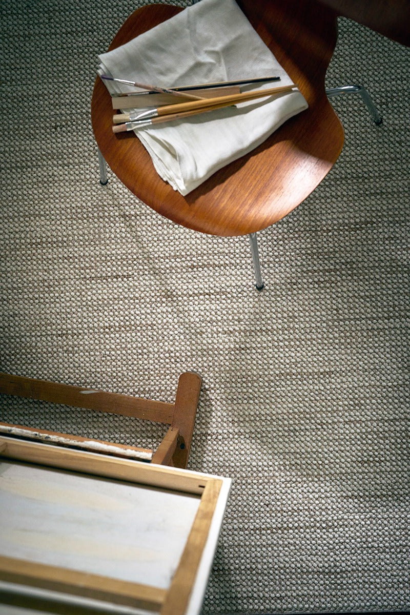 Textured area rug in stone and beige hues