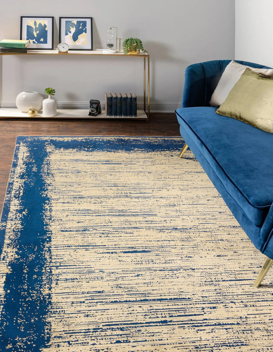 Acrylic shrink and viscose area rug in shades of twilight navy and gold 
