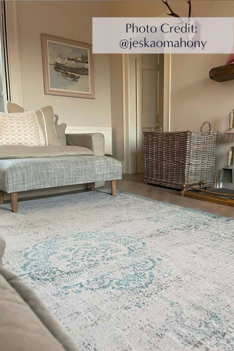 Grey flatweave rug with faded green persian design