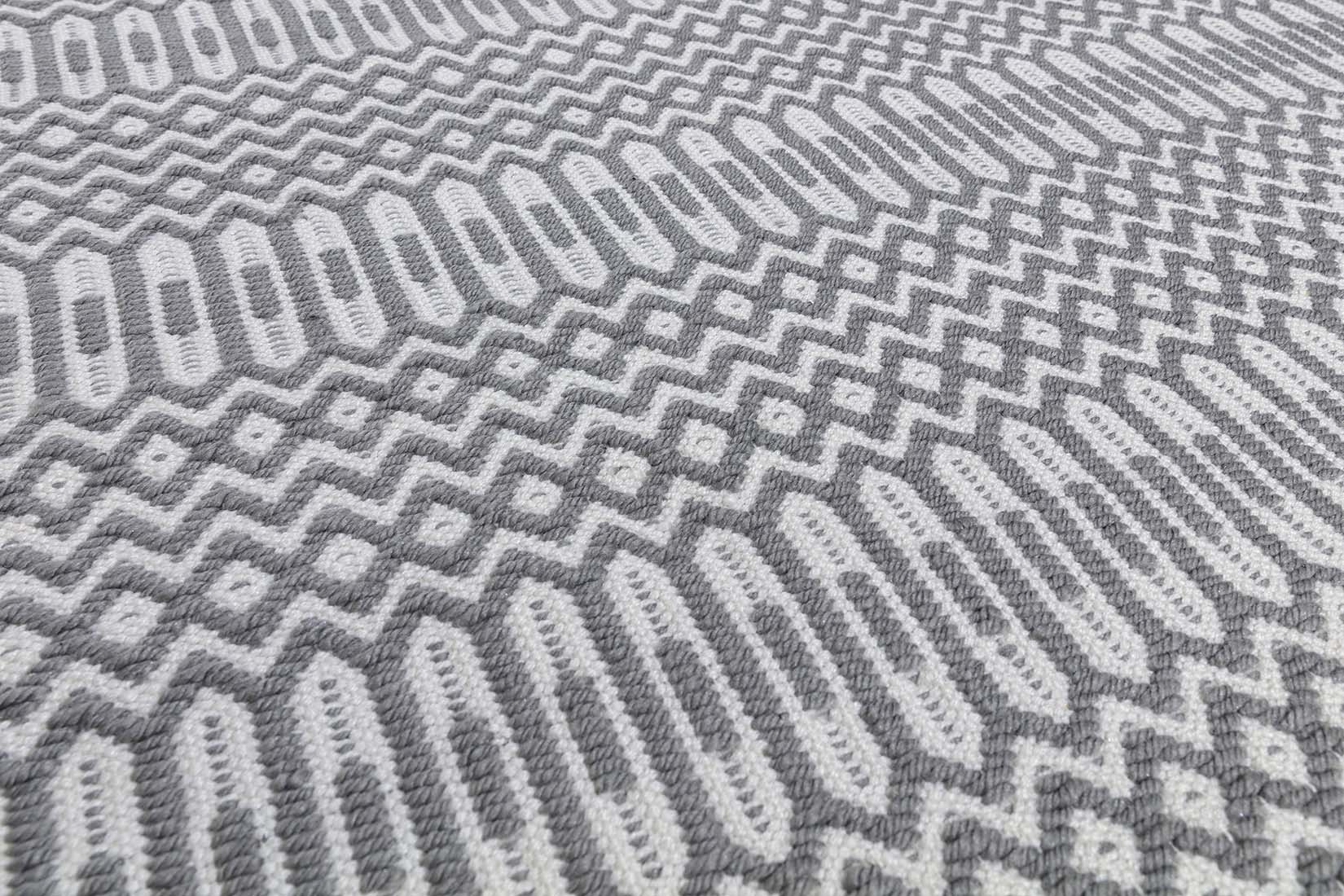 grey indoor/outdoor rug with geometric design