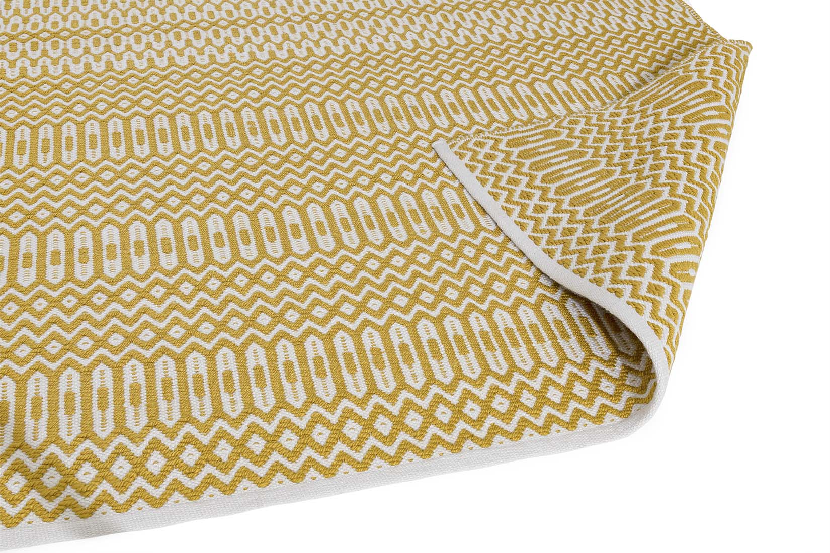 yellow indoor/outdoor rug with geometric design