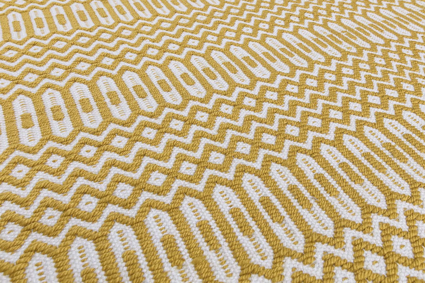 yellow indoor/outdoor rug with geometric design