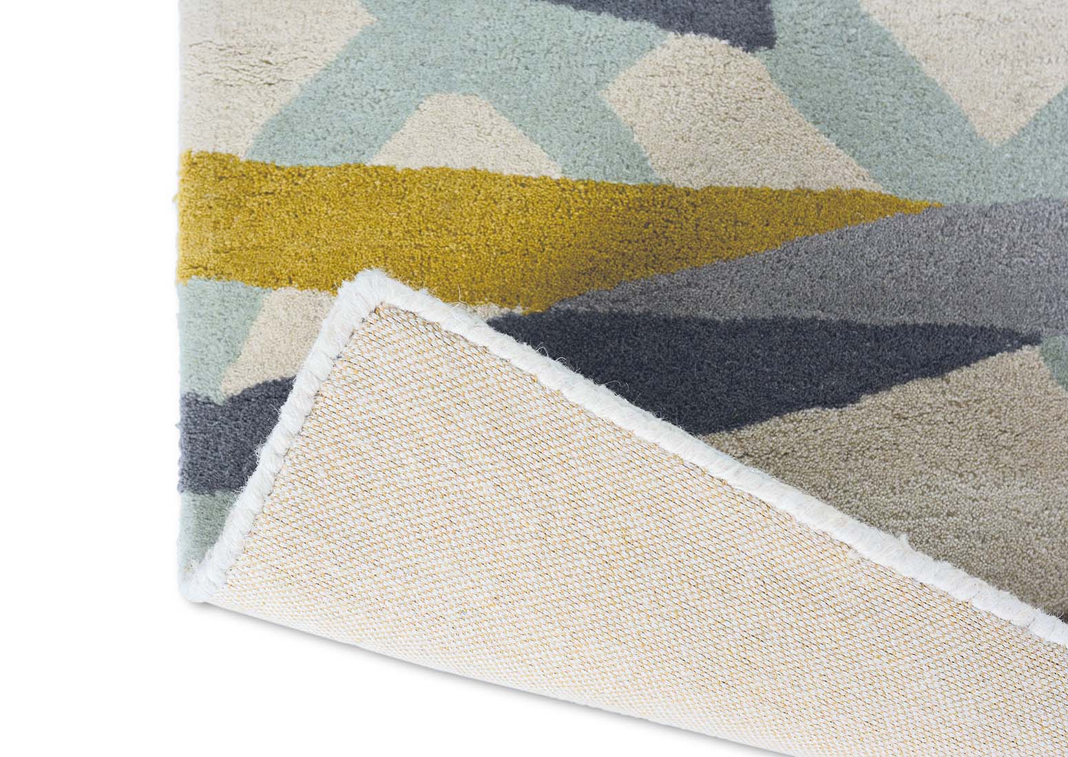 mint green wool rug with abstract design in mustard, grey and taupe