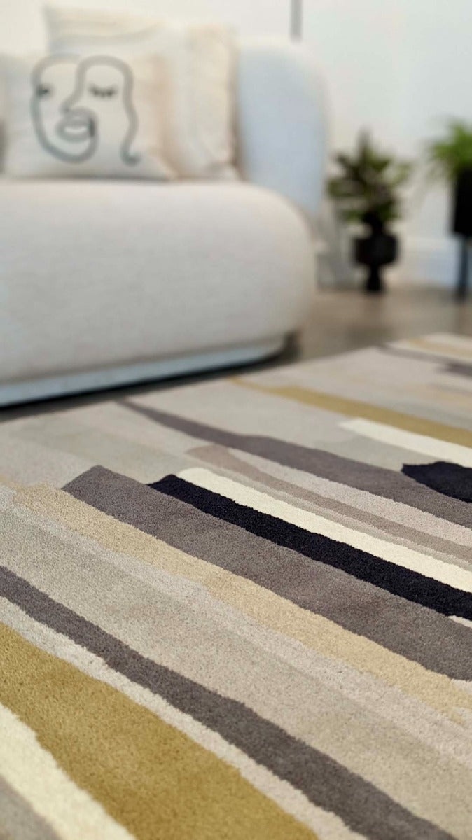 Rectangular white wool rug with pink, yellow, purple and green flowers and leaves