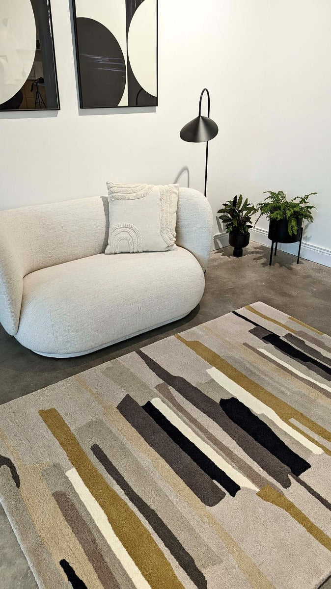 Rectangular white wool rug with pink, yellow, purple and green flowers and leaves