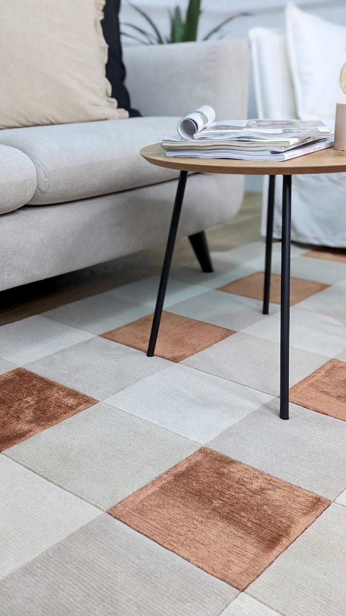 cream and copper rug with geometric pattern