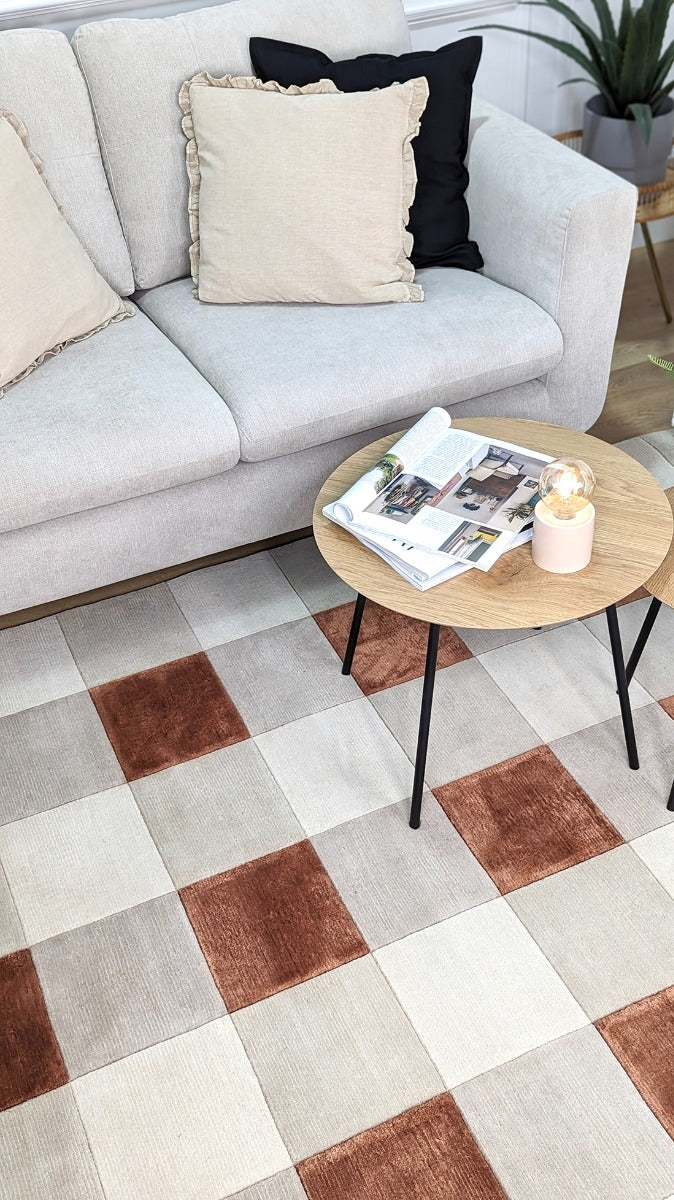 cream and copper rug with geometric pattern