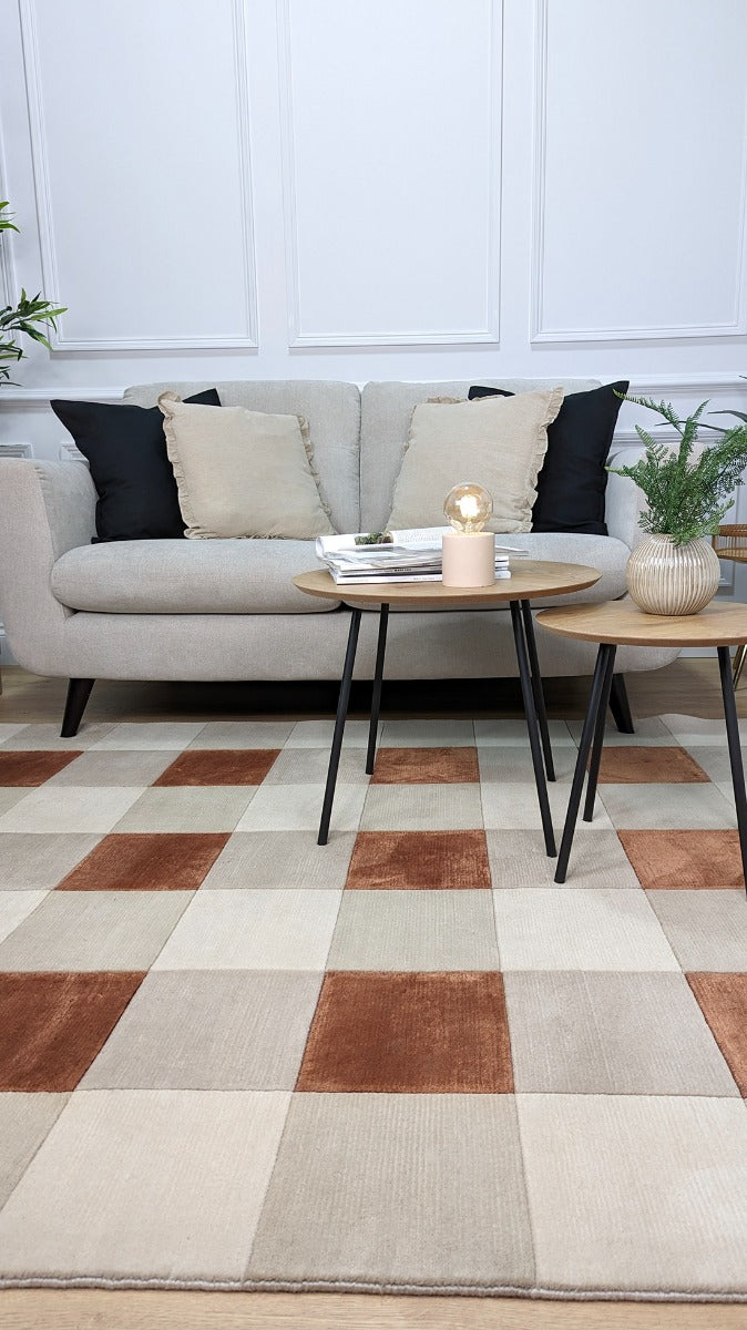 cream and copper rug with geometric pattern