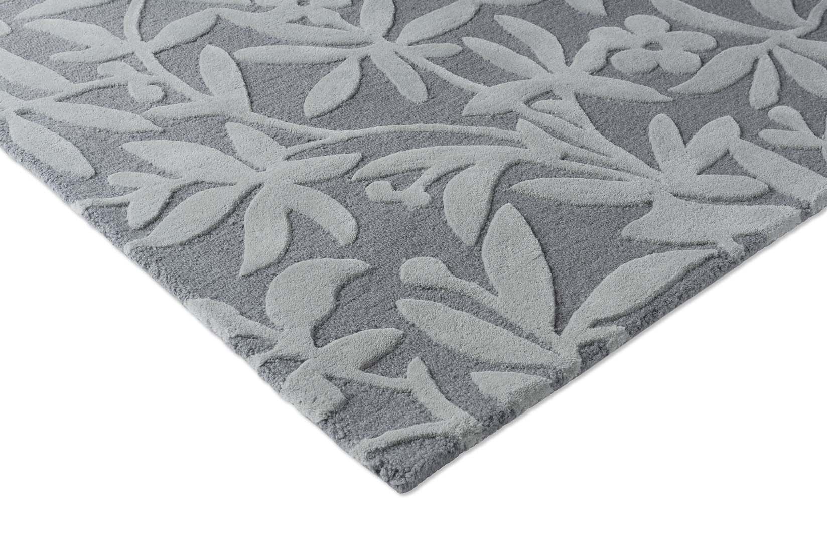 Grey wool rug with hand carved floral motifs
