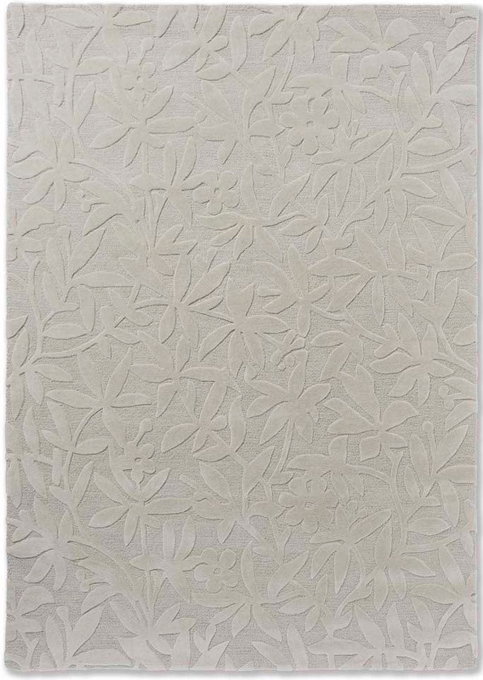 Beige wool rug with hand carved floral motifs