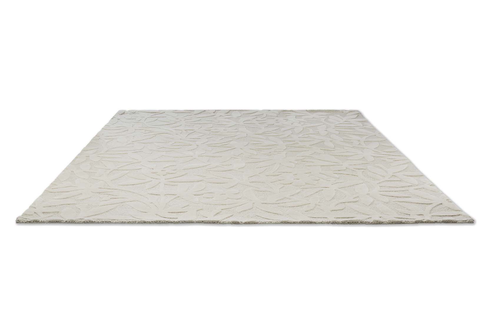 Beige wool rug with hand carved floral motifs