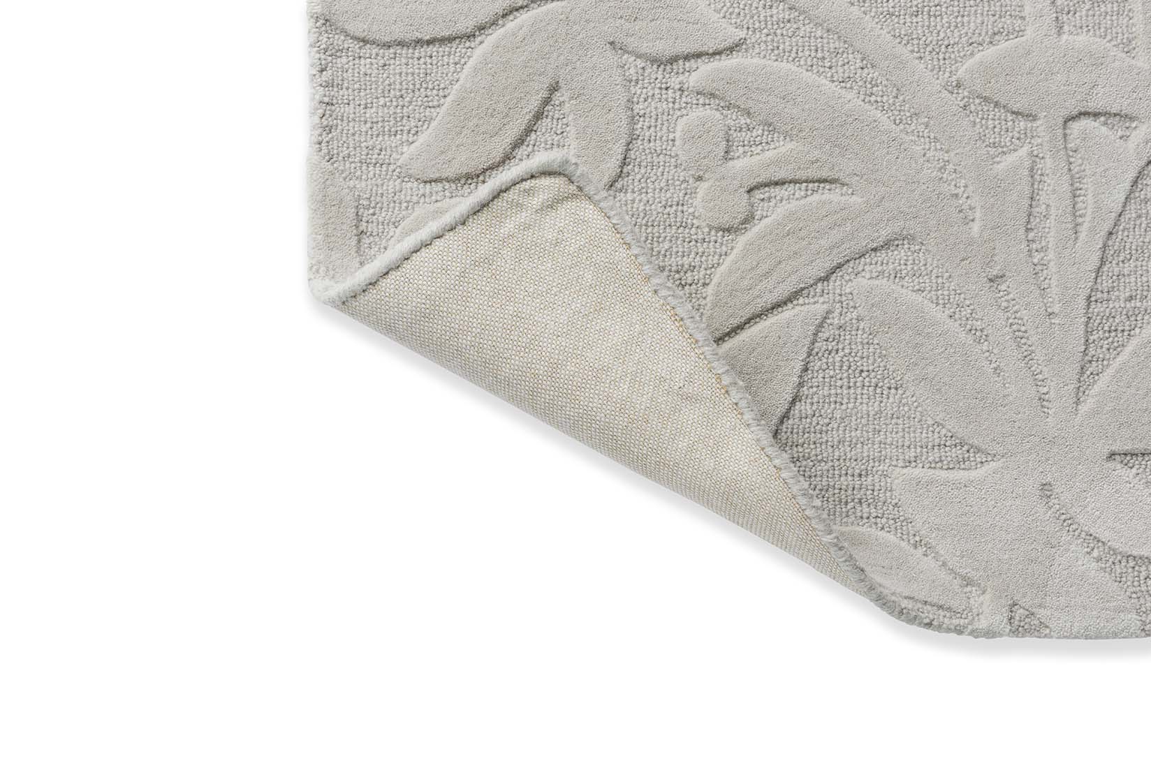 Beige wool rug with hand carved floral motifs