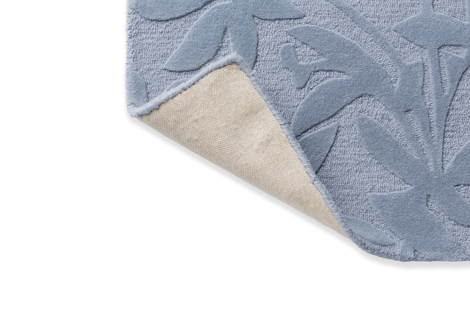 Blue wool rug with hand carved floral motifs