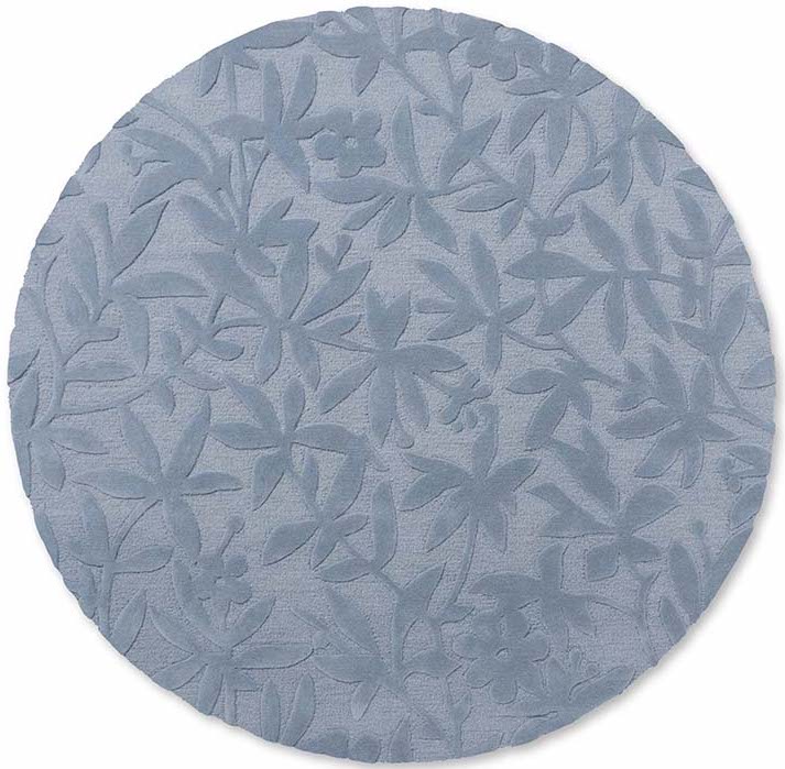 Blue wool circular rug with hand carved floral motifs