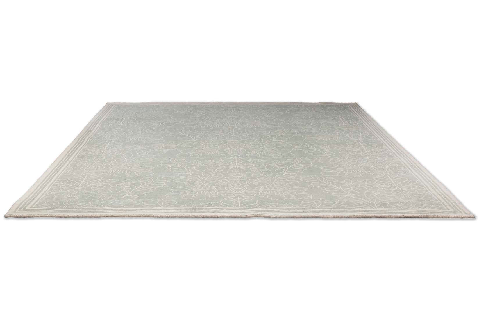 Green cotton rug in damask pattern

