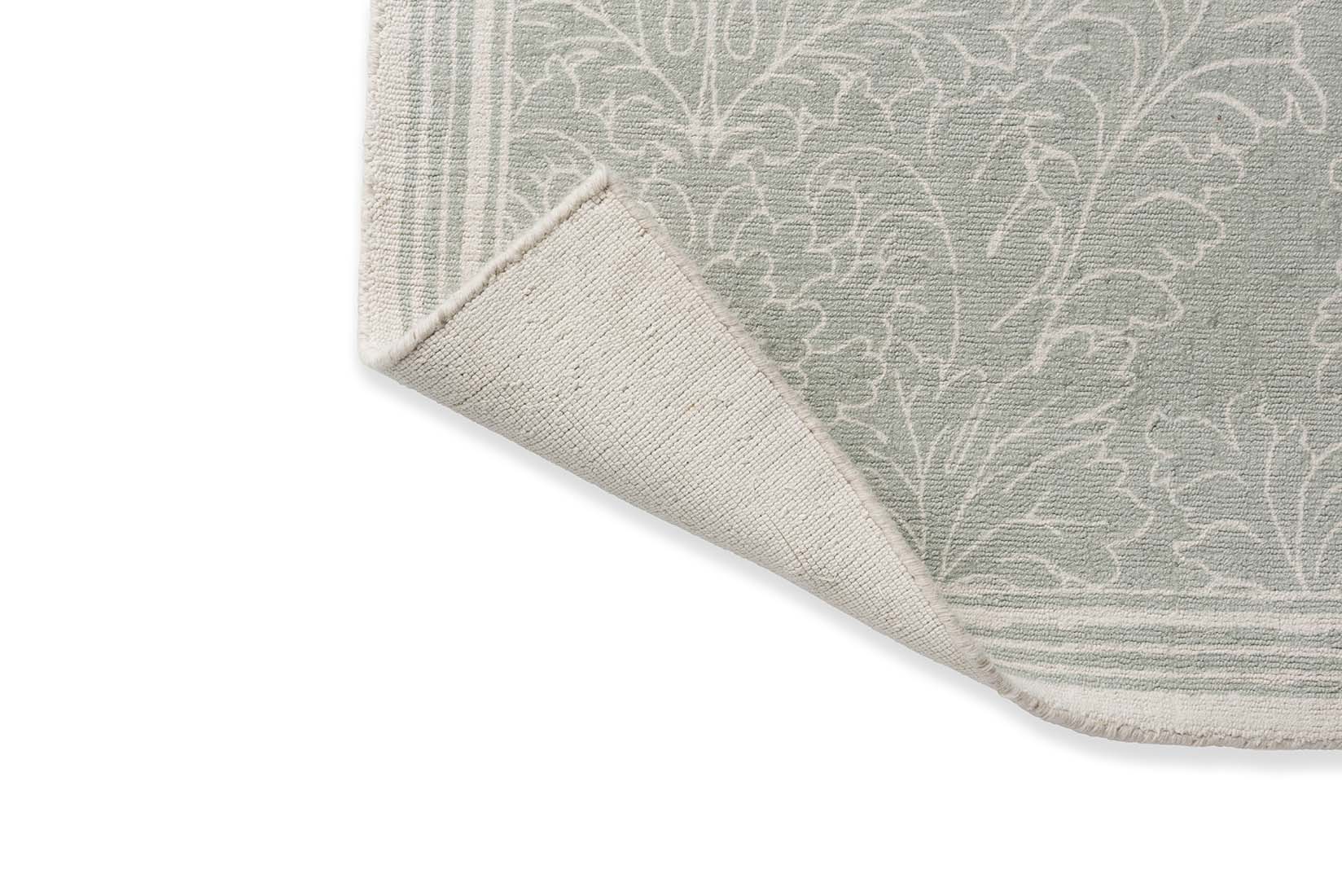 Green cotton rug in damask pattern