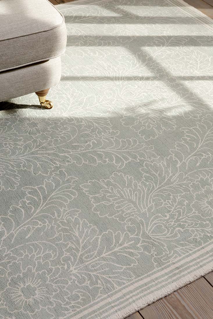 Green cotton rug in damask pattern