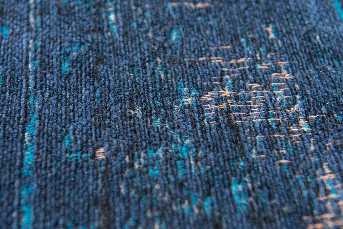 Blue flatweave rug with faded persian design