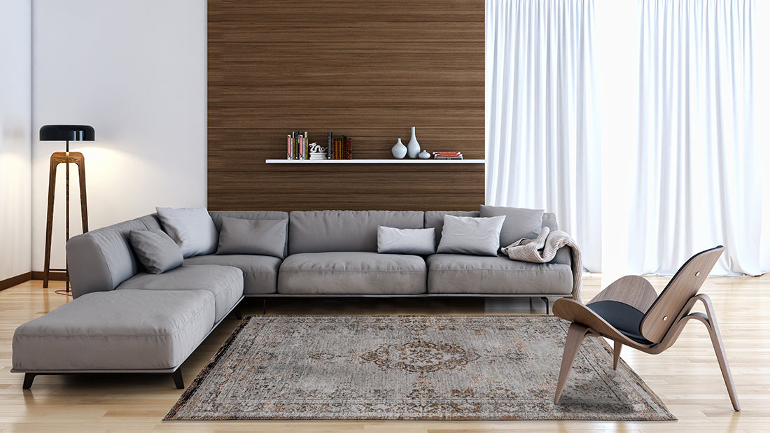 Grey and brown flatweave rug with faded persian medallion pattern