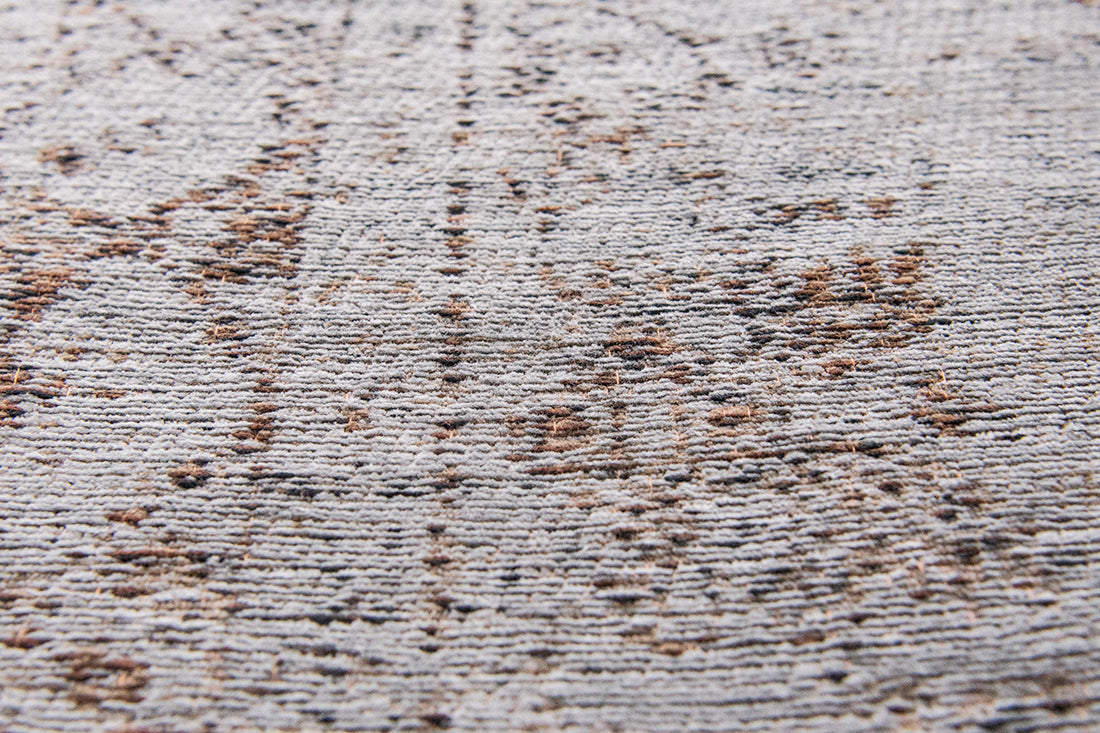 Grey and brown flatweave rug with faded persian medallion pattern