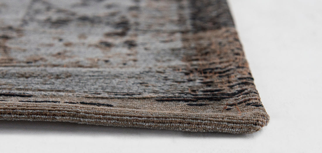Grey and brown flatweave rug with faded persian medallion pattern