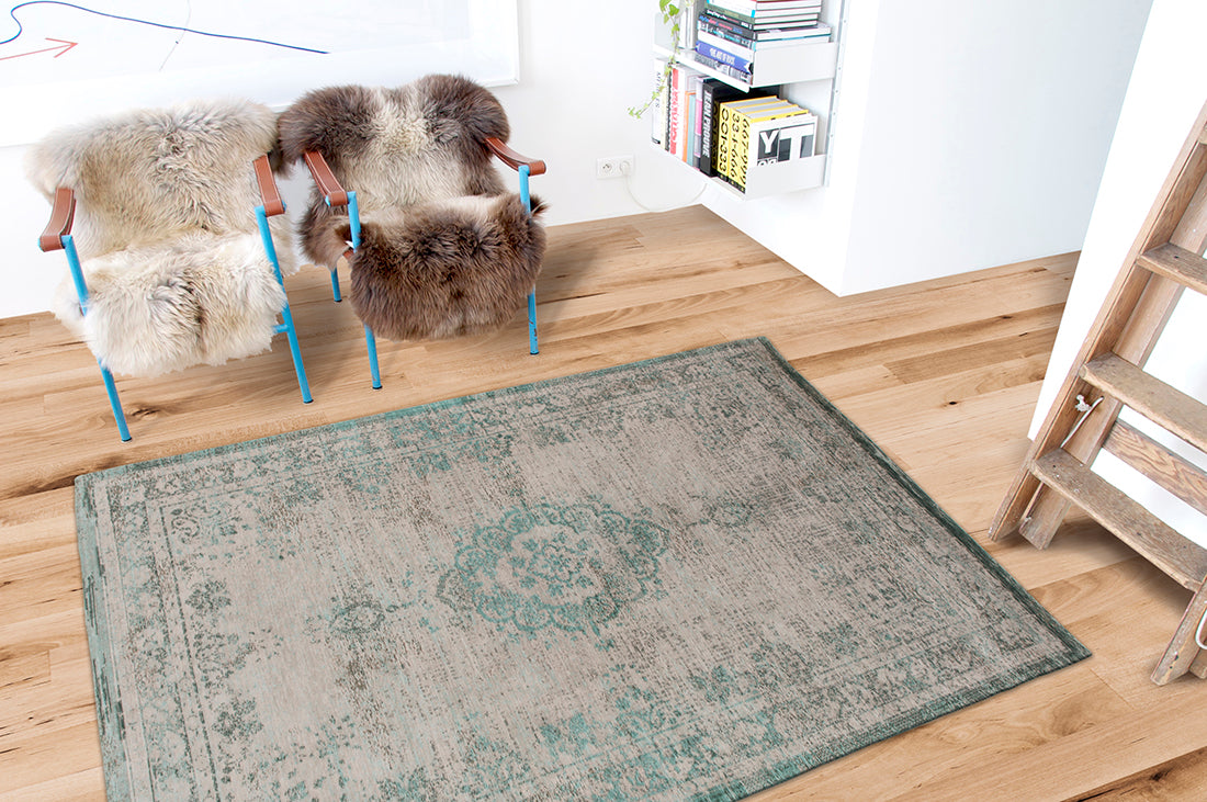 Grey flatweave rug with faded green persian design
