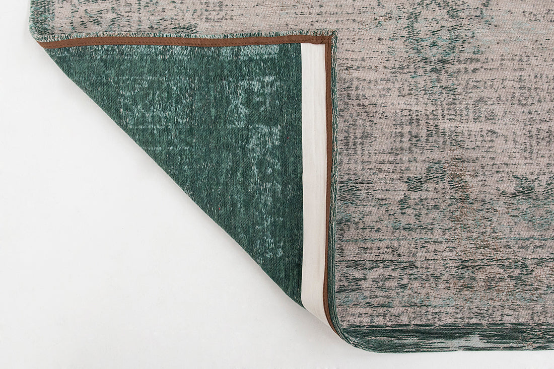 Grey flatweave rug with faded green persian design