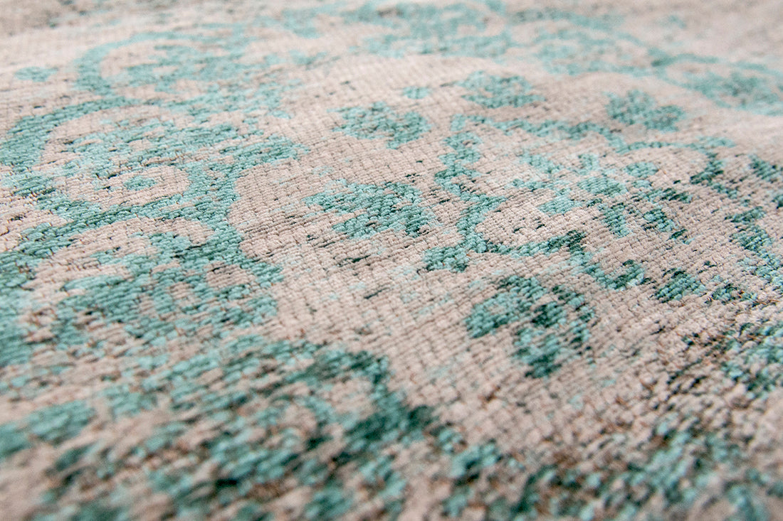 Grey flatweave rug with faded green persian design