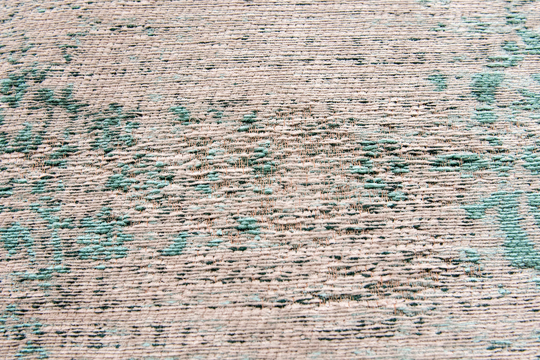 Grey flatweave rug with faded green persian design