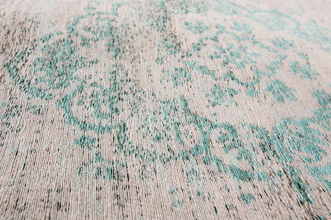 Grey flatweave rug with faded green persian design