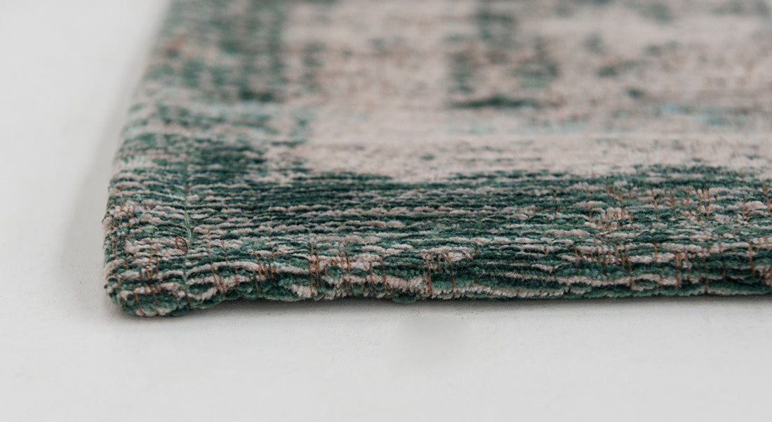 Grey flatweave rug with faded green persian design