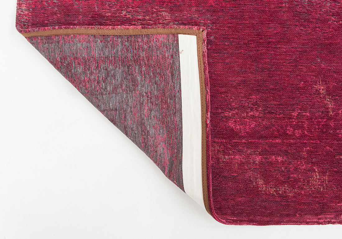 Red rug with faded persian design