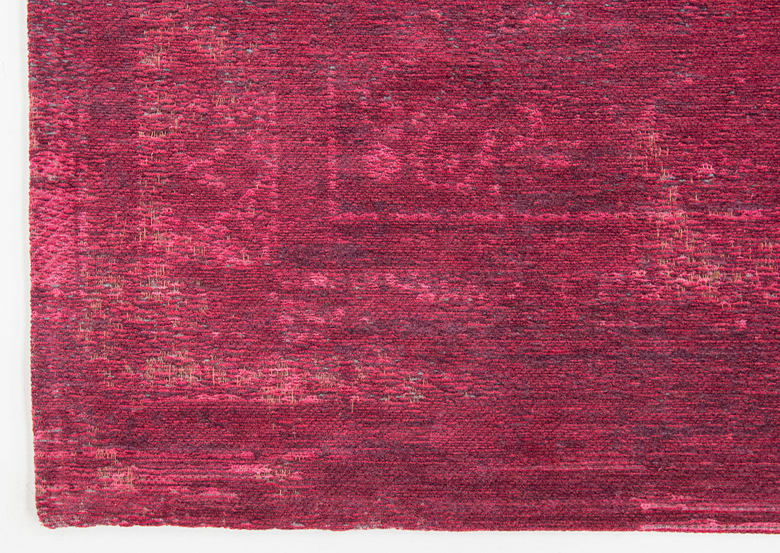 Red rug with faded persian design