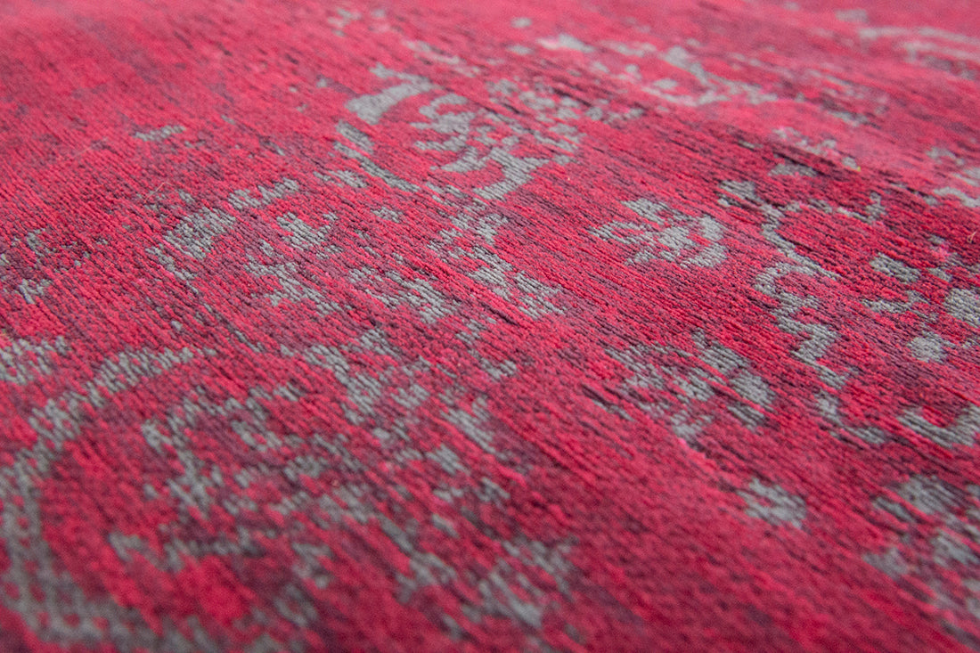 Red rug with faded persian design
