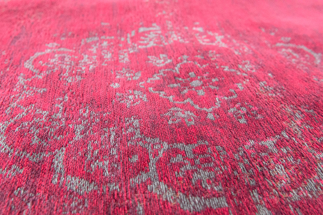 Red rug with faded persian design
