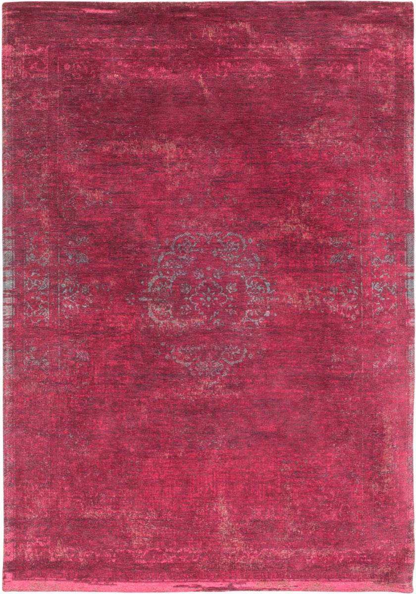 Red rug with faded persian design