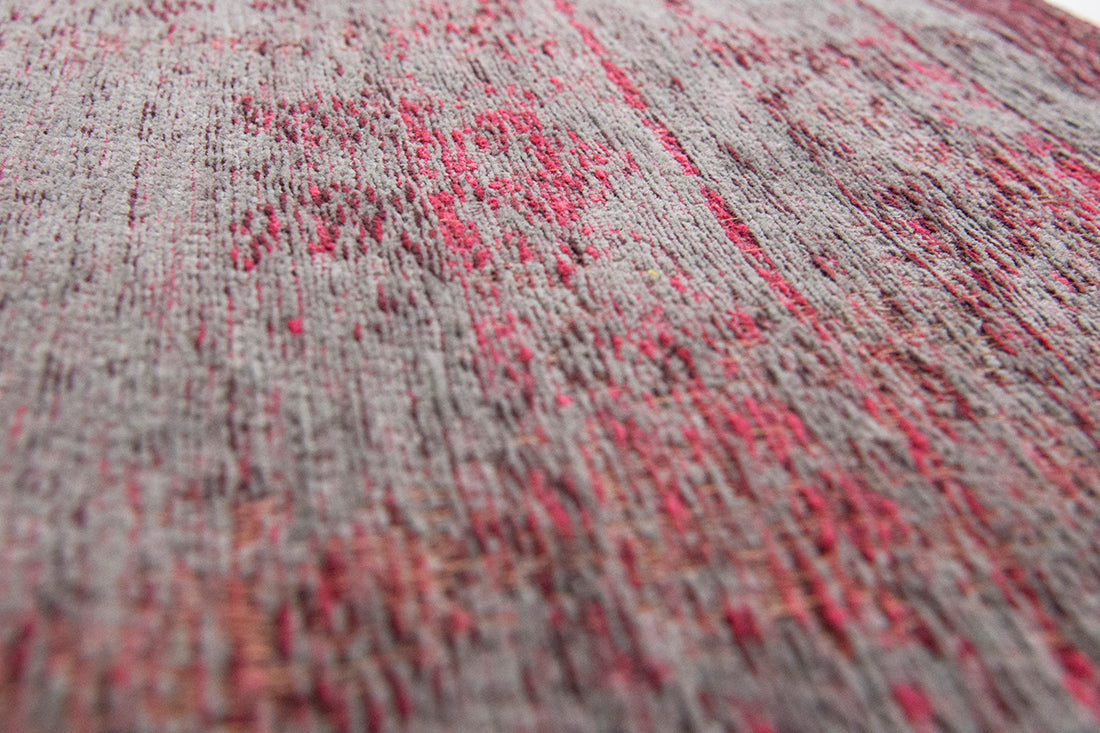 Grey and pink flatweave rug with faded persian design