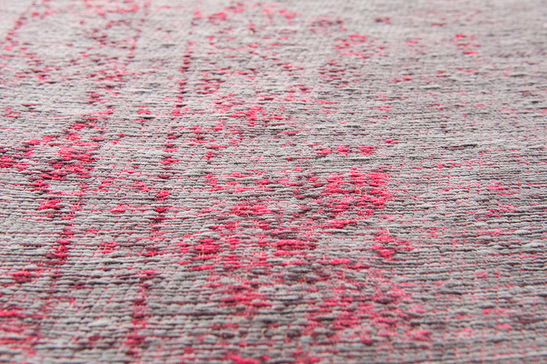 Grey and pink flatweave rug with faded persian design