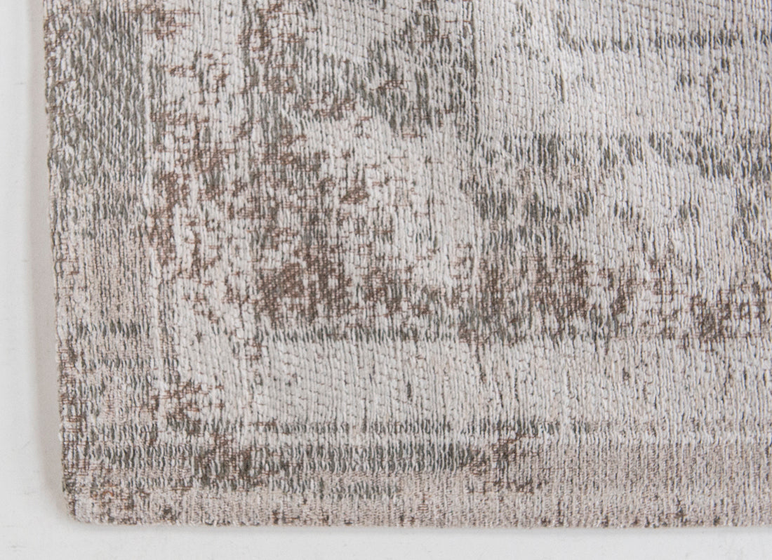 Grey rug with faded persian design