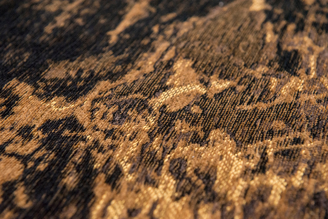 Flatweave rug with faded jagged abstract design in copper and charcoal