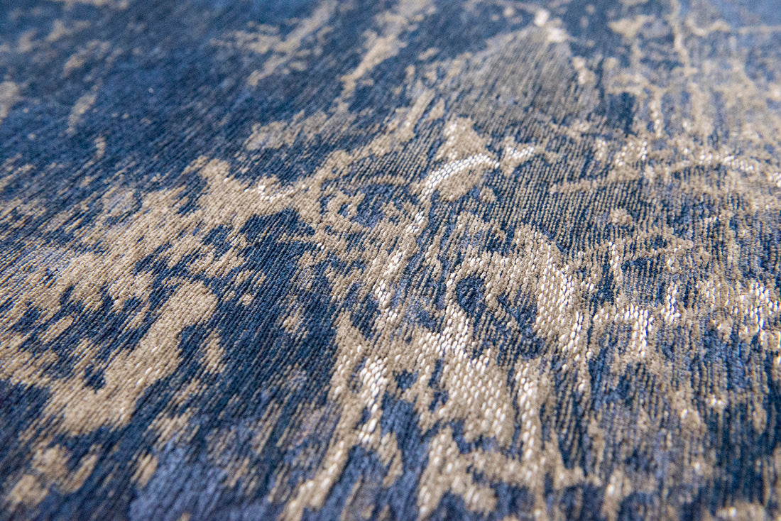 Flatweave rug with faded jagged abstract design in beige and blue