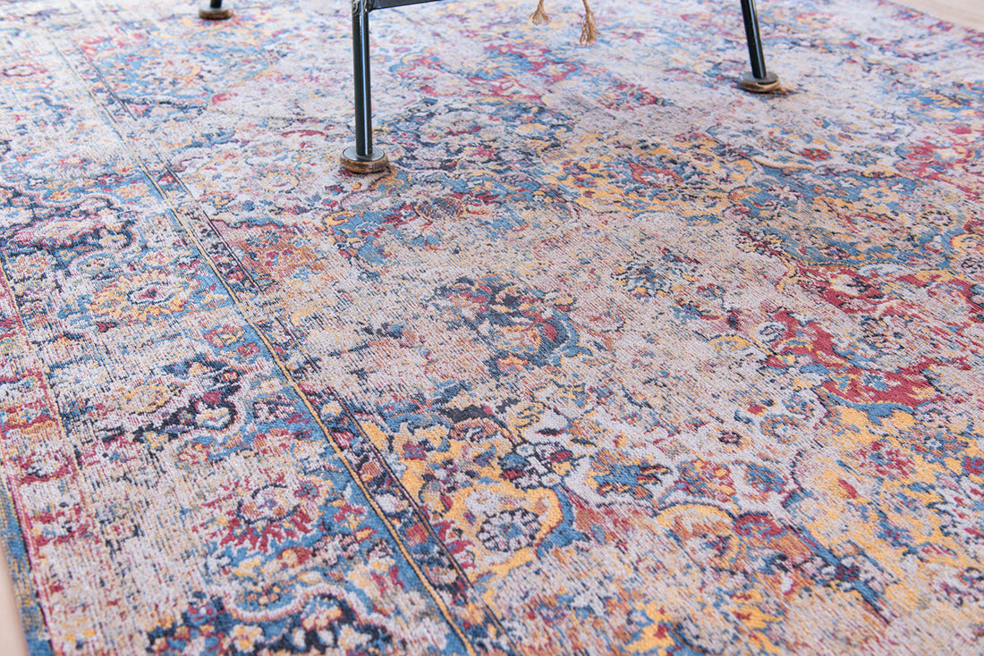 Flatweave rug with faded persian design in blue