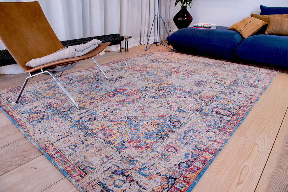 Flatweave rug with faded persian design in blue