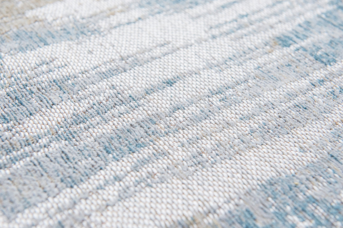 Flatweave rug with abstract stripe design in blue