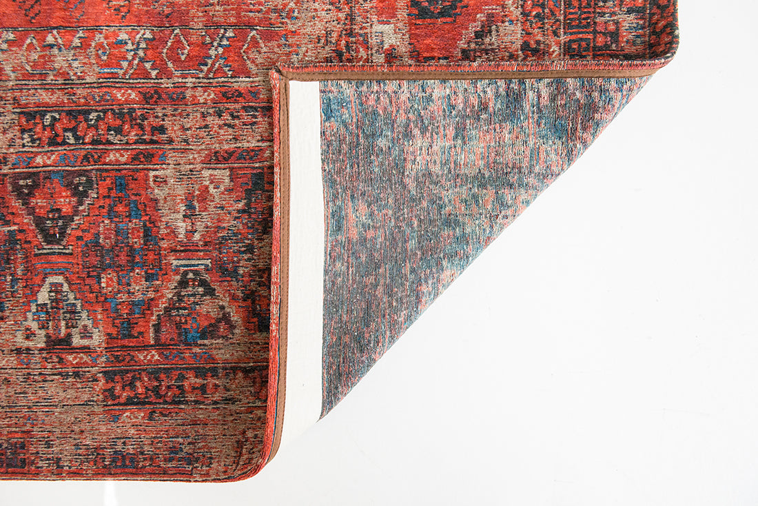 Red flatweave rug with faded persian design of floral motifs and gul medallions